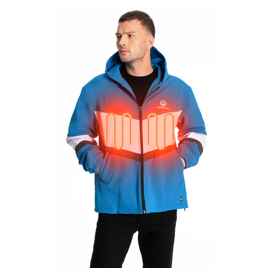 A man wearing a cobalt blue Hestiia heated jacket with integrated glowing orange heating coils depicting the heating zones on either side of the chest. The jacket has a white and gray sleeve design, a hood, elastic hem, and a visible Hestiia logo on the left chest.