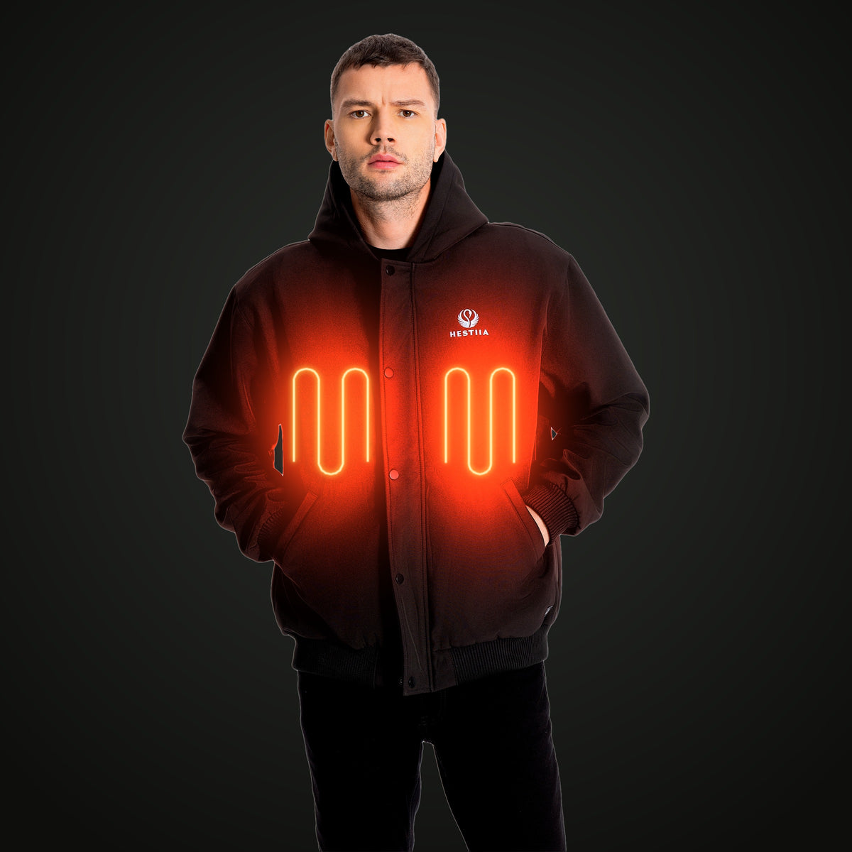 7K1 Black heated jacket, heat panels glowing on the chest, dark studio