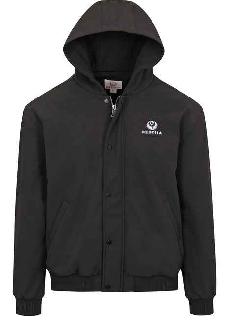 Front view of the 7K1 heated bomber dark charcoal colored jacket with the hood up. The Hestiia logo is white and embroidered on the wearer's left side, near the top of the chest area. Storm flap is snapped up, with the exception of the top button, where you can see the zipper zipped up undernearth. Jacket has ribbed-knit hem at the cuffs and waistline. There are two pockets on the front of the jacket on either side.