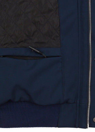 Close up of the interior jacket area on wearer's left side at the lower corner near the zipper. The battery storage pocket can be seen zipped open with the heating system connector wire protruding from the jacket, demonstrating where the small battery pack is stored. Interior quilted lining can be seen.